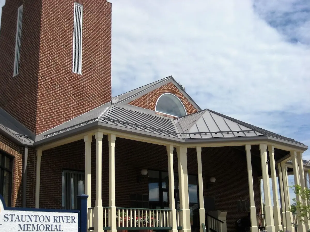 Skilled roofing craftsmen working on a residential roof in Lyman
